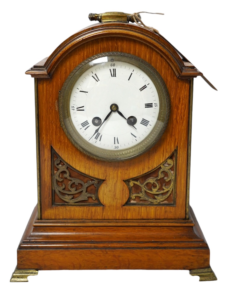 A 19th century mahogany eight day mantel clock with enamel dial and pendulum, 30cm high. Condition - fair, not tested